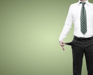businessman standing with pockets turned inside out